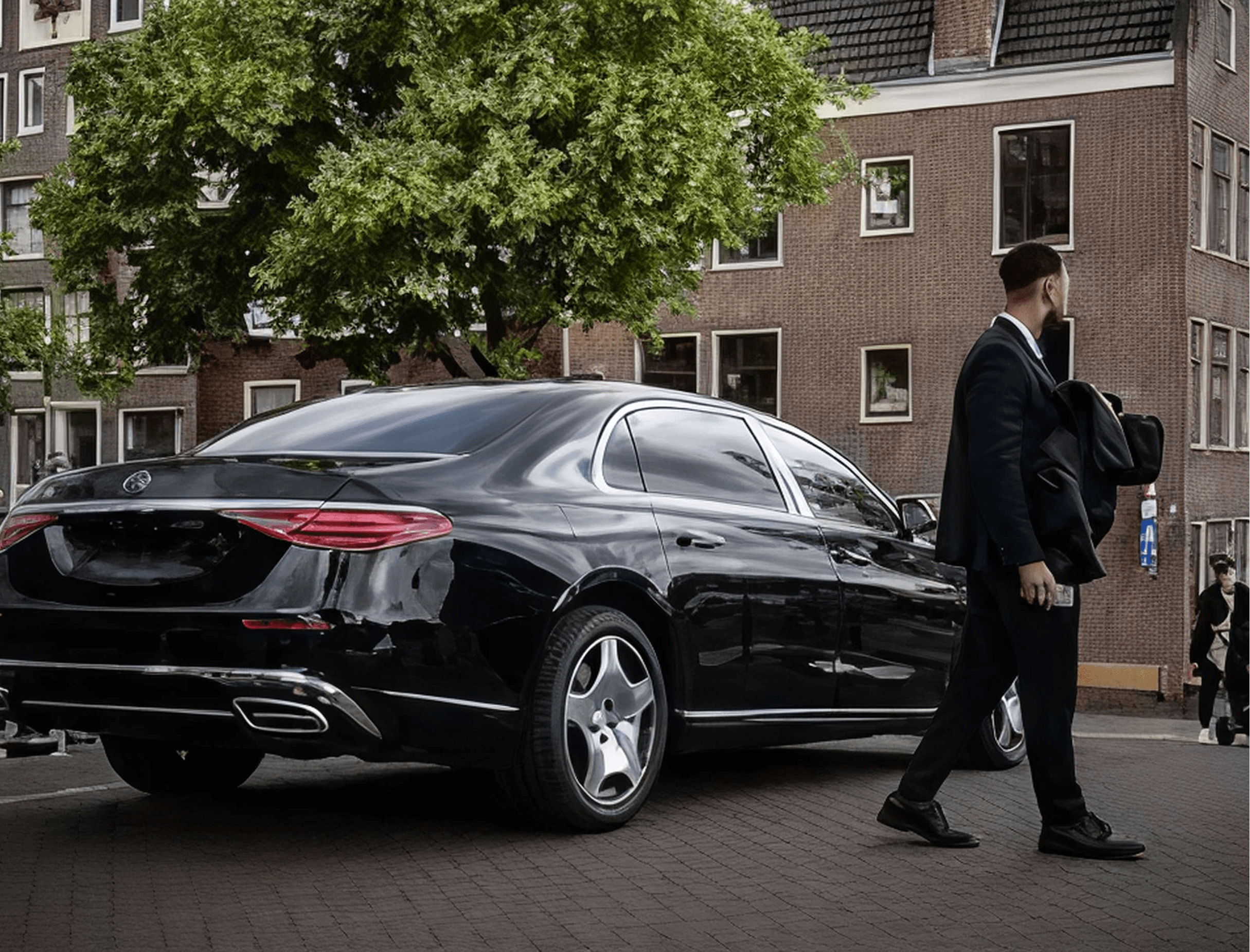 Professional chauffeur opening car door in Leeds